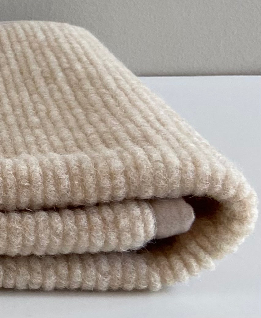 Onderlegger ledikant Ribstructuur - 100% Merinowol 🫧